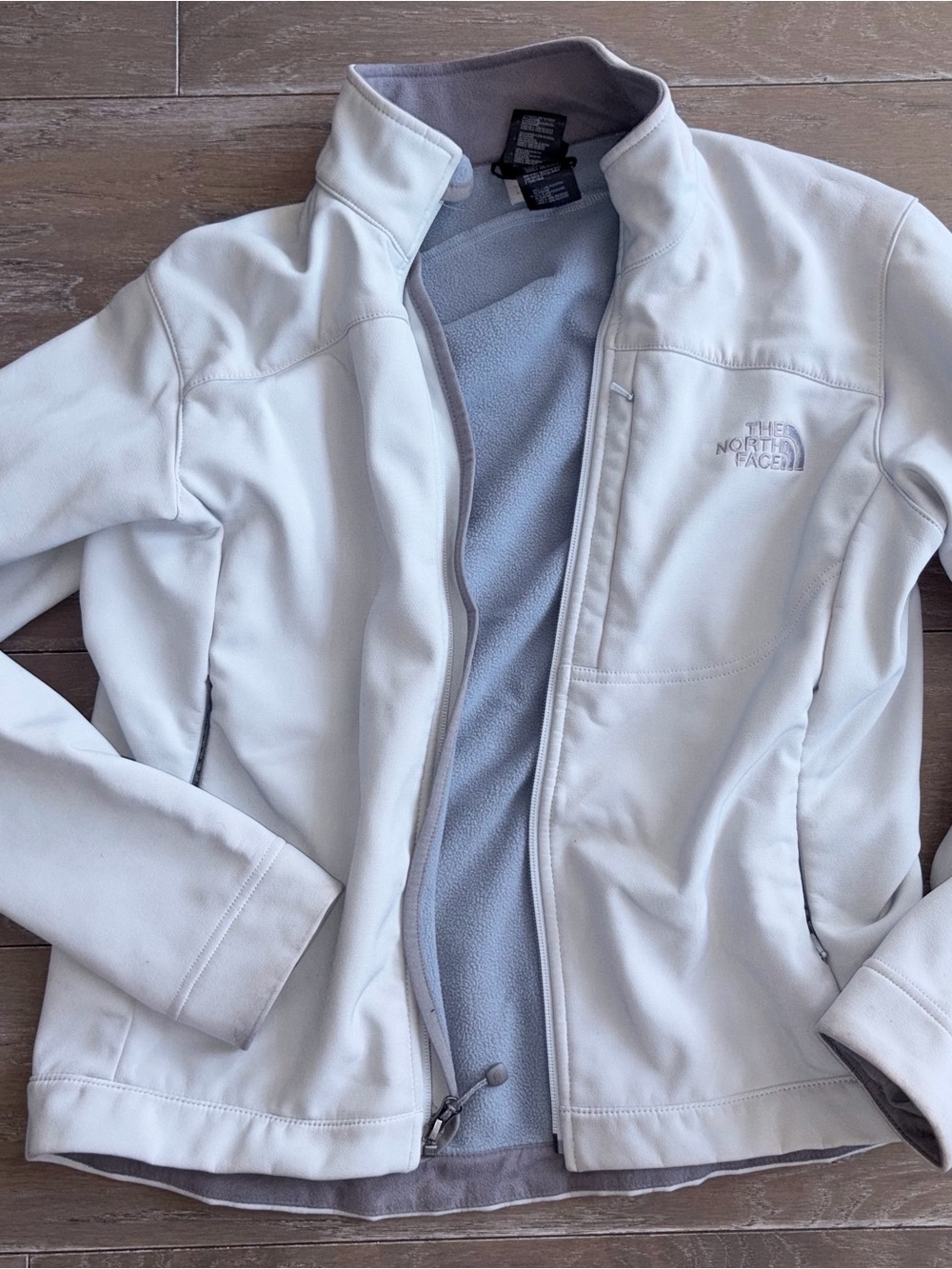 The North Face Women's White Softshell Jacket with Light Gray Fleece Lining